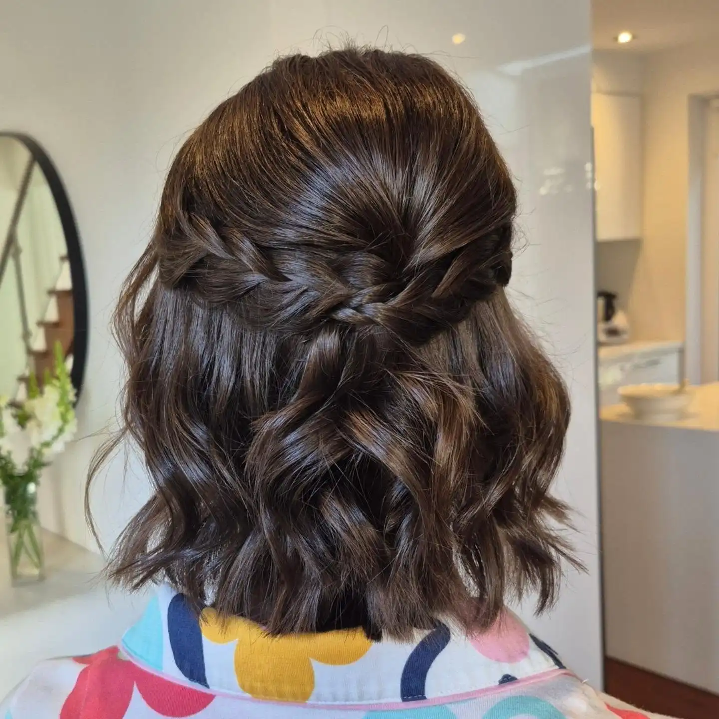 Dark Wavy Bob with Twisted Half Up Detail