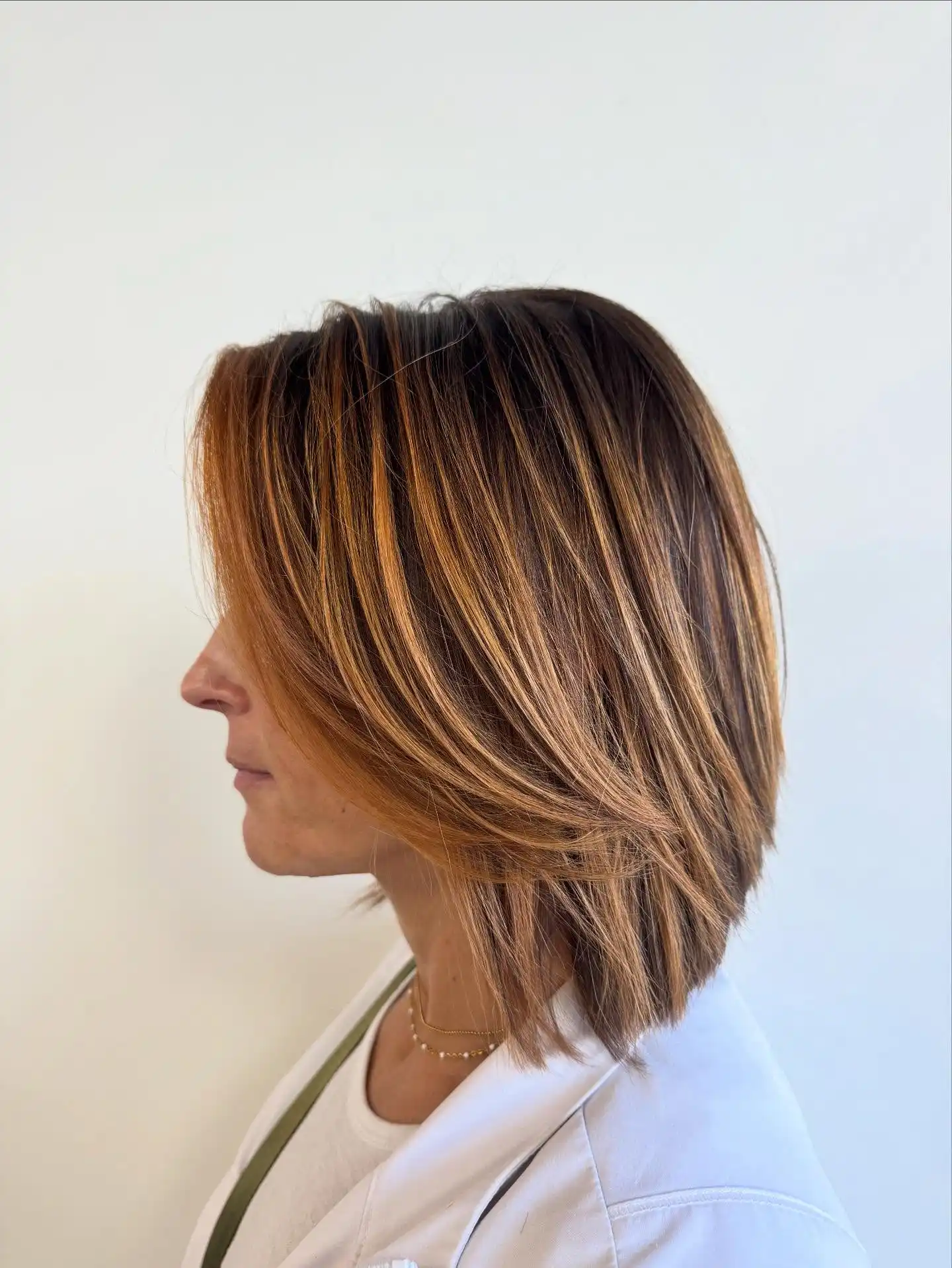 Layered Angled Bob with Warm Caramel Highlights