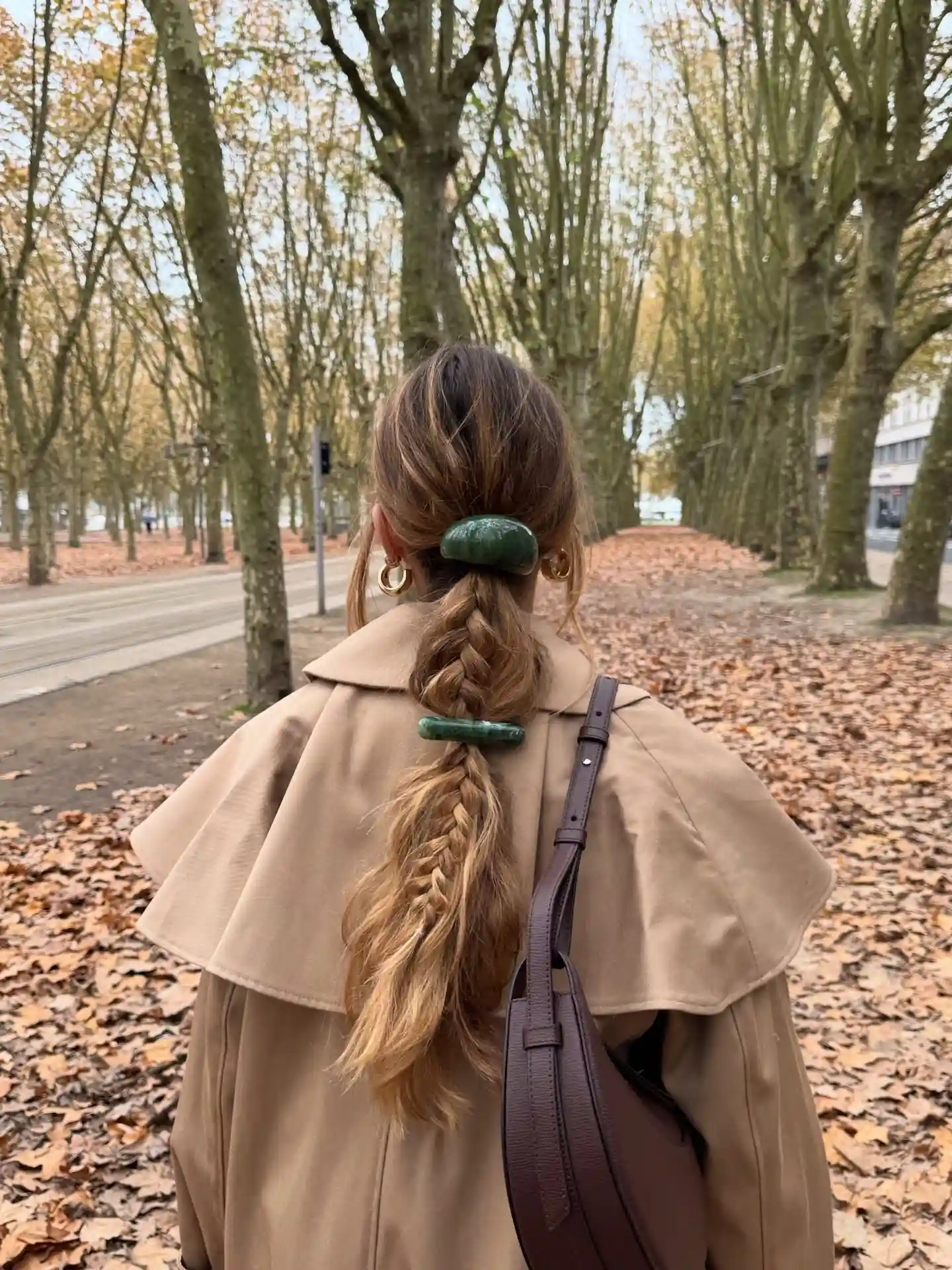  Low Braided Ponytail with Sculptural Green Barrettes