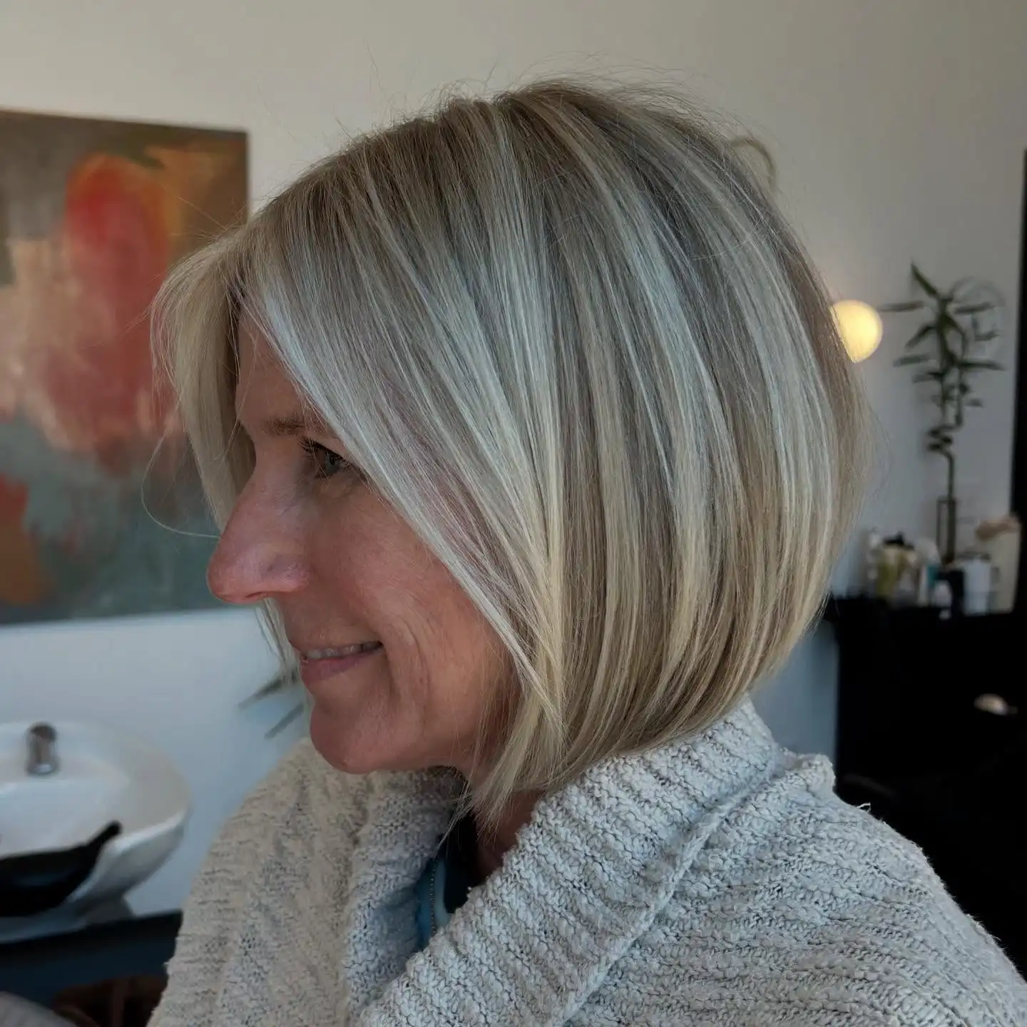 Sleek Blonde Chin Length Bob with Side Part