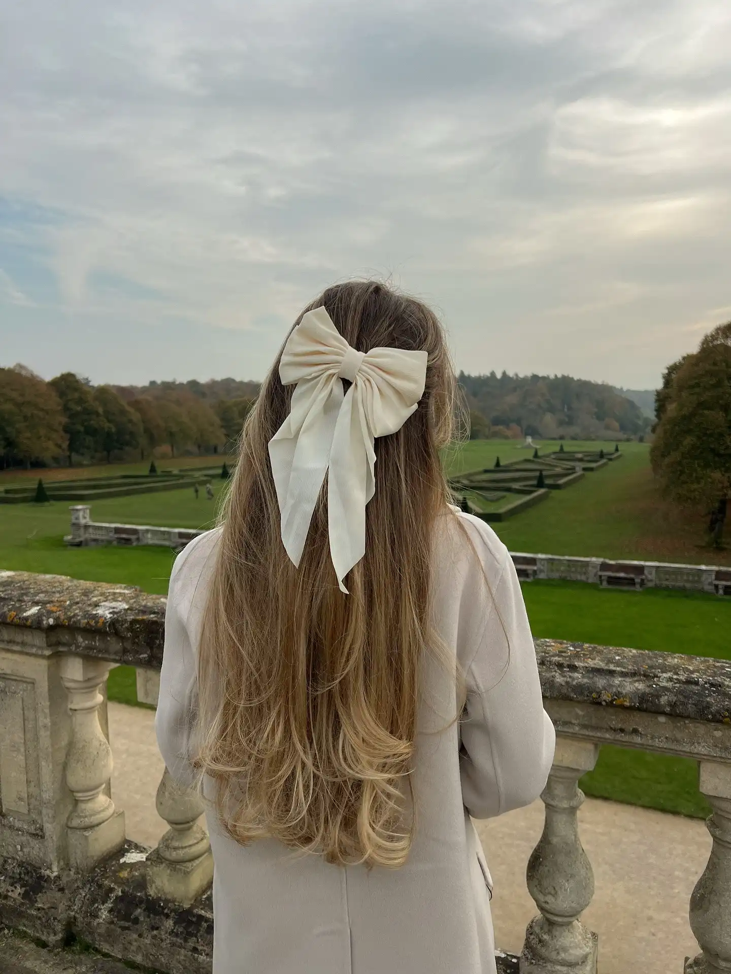 Half Up Style with an Oversized Ivory Bow