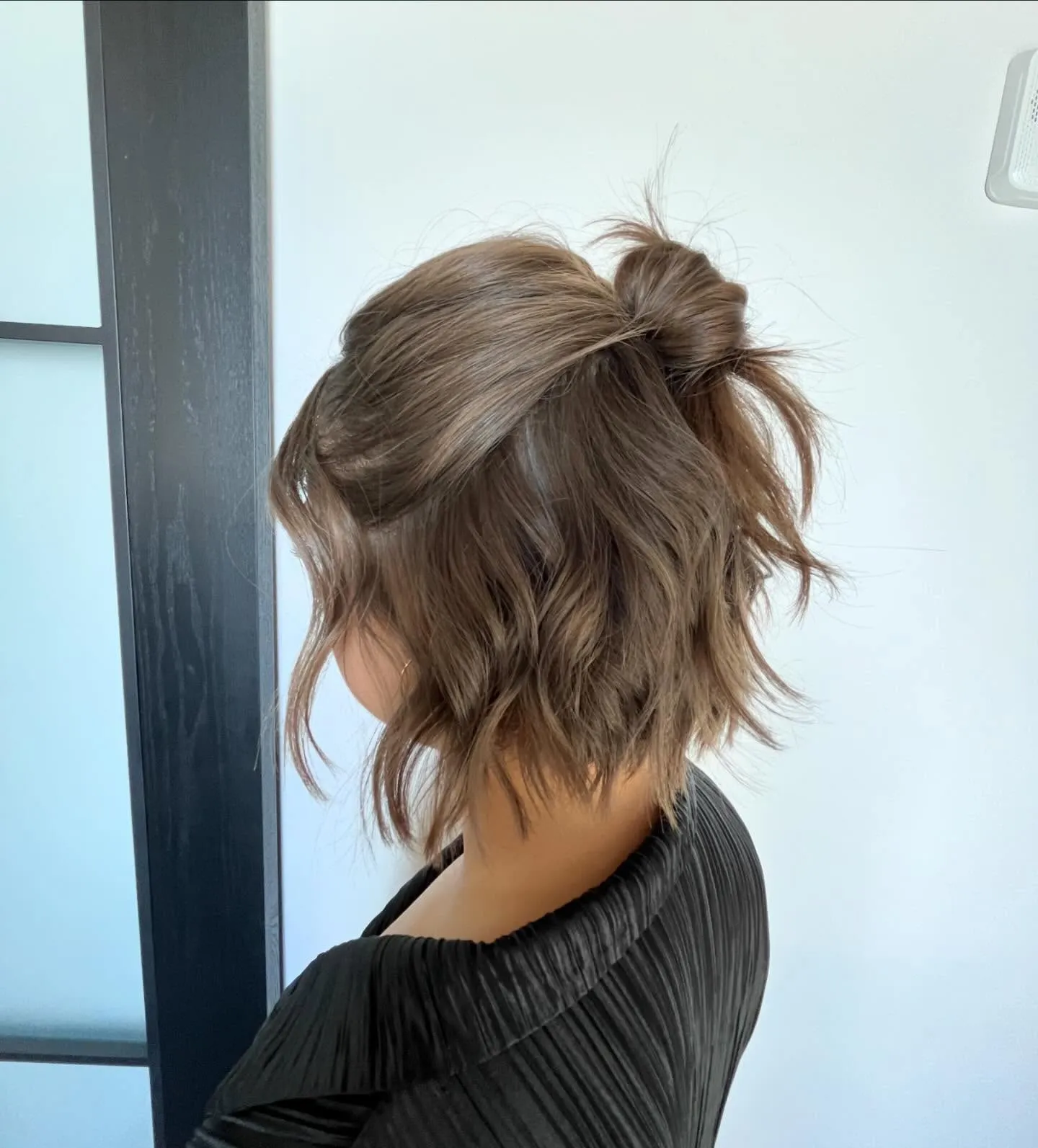 Soft Half Up Bun with Tousled Short Layers