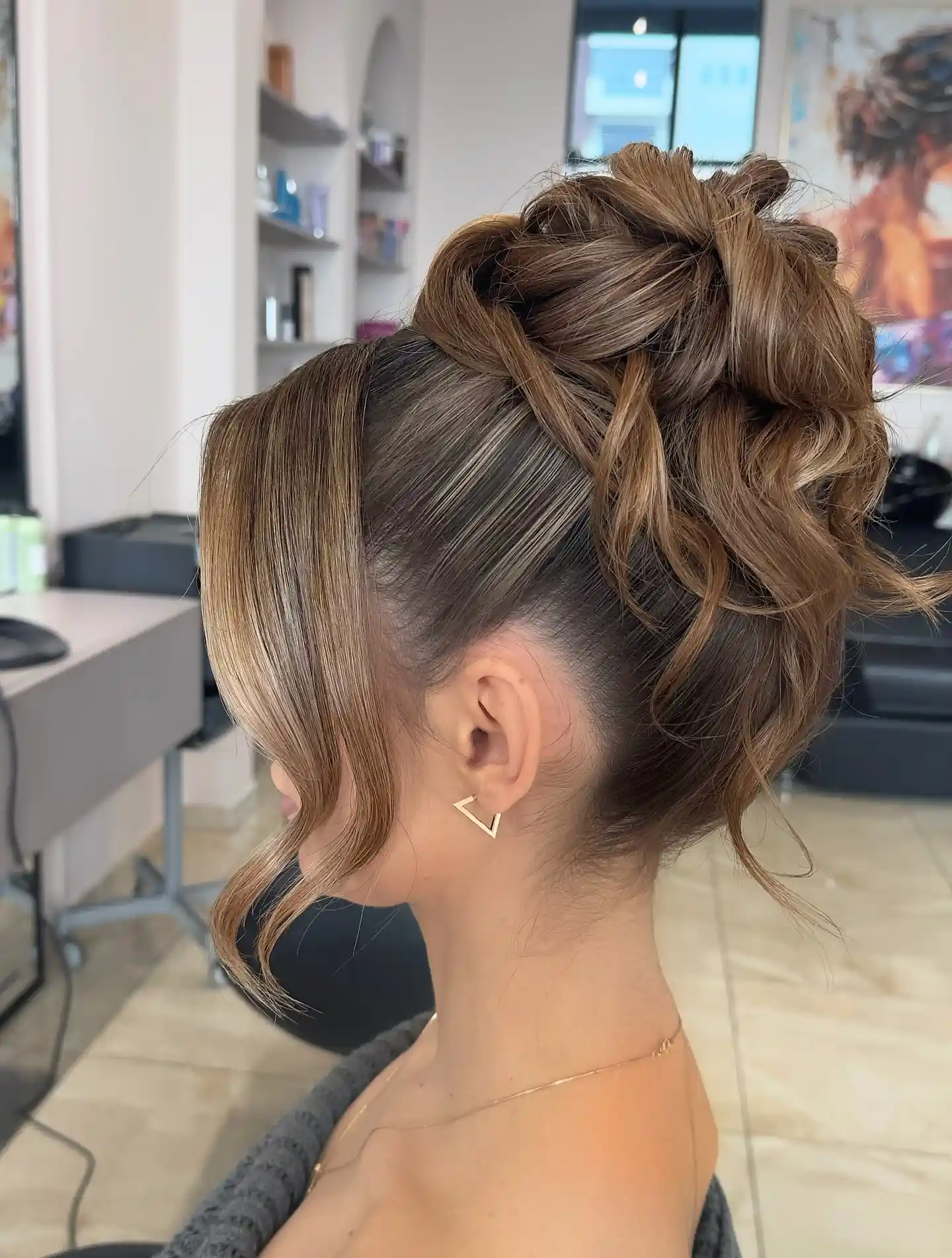 Textured High Bun with Soft Face Framing Pieces