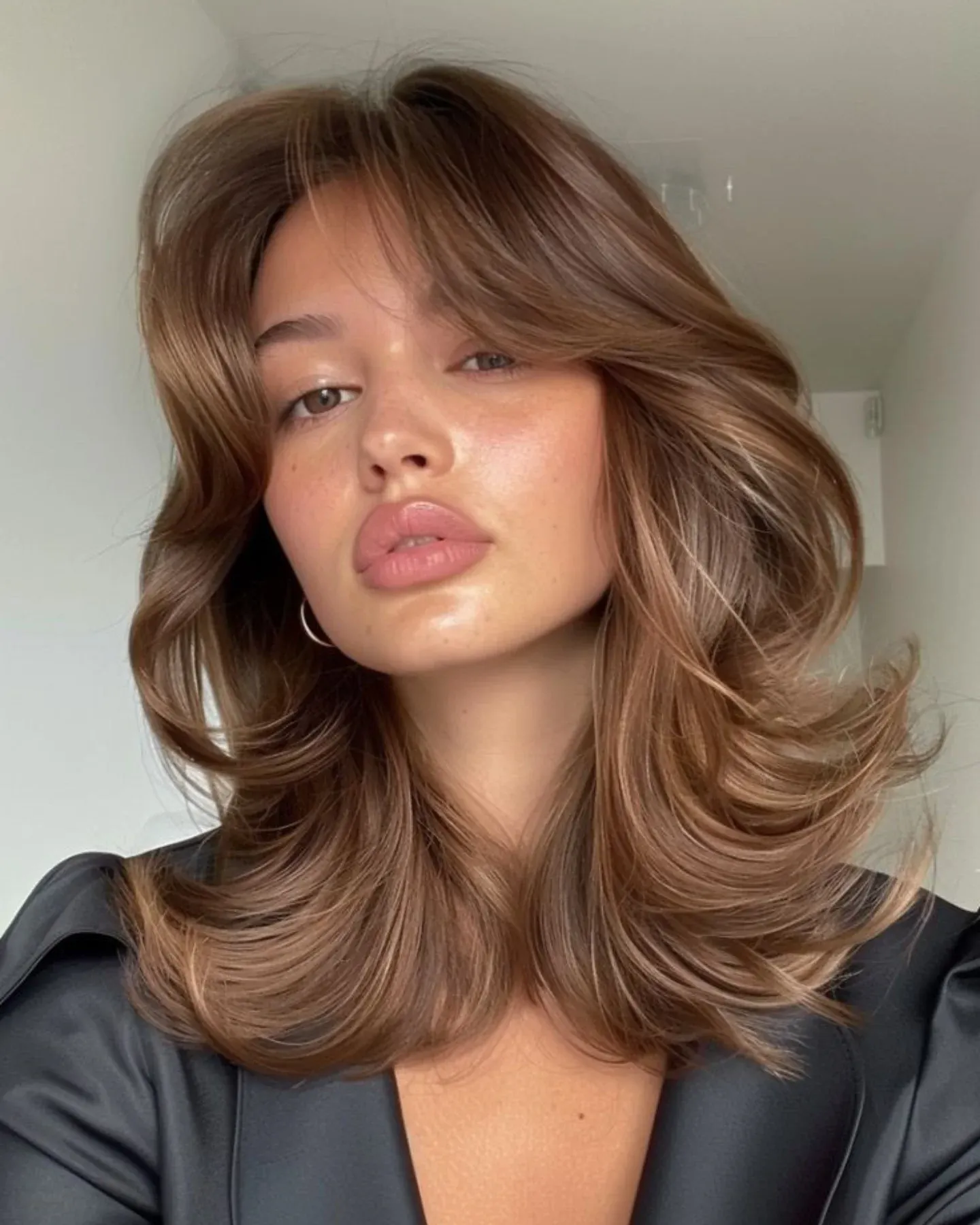  Voluminous Blowout with Soft Curtain Bangs